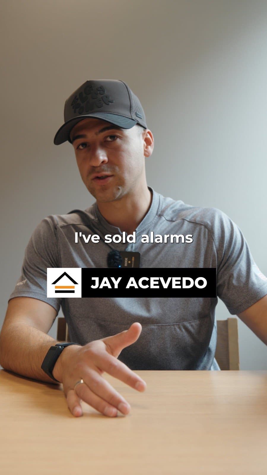 Flex PWR rep Jay Acevedo talking to camera at a table, on-screen caption reading I've sold alarms