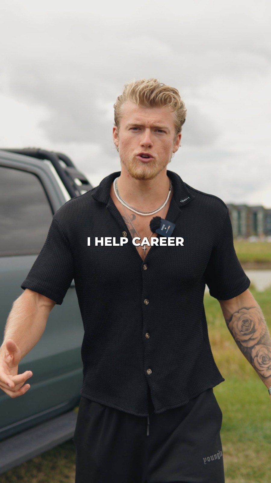 Brandon Clark in a black shirt talking to camera beside a truck on grass, on-screen caption reading I help career