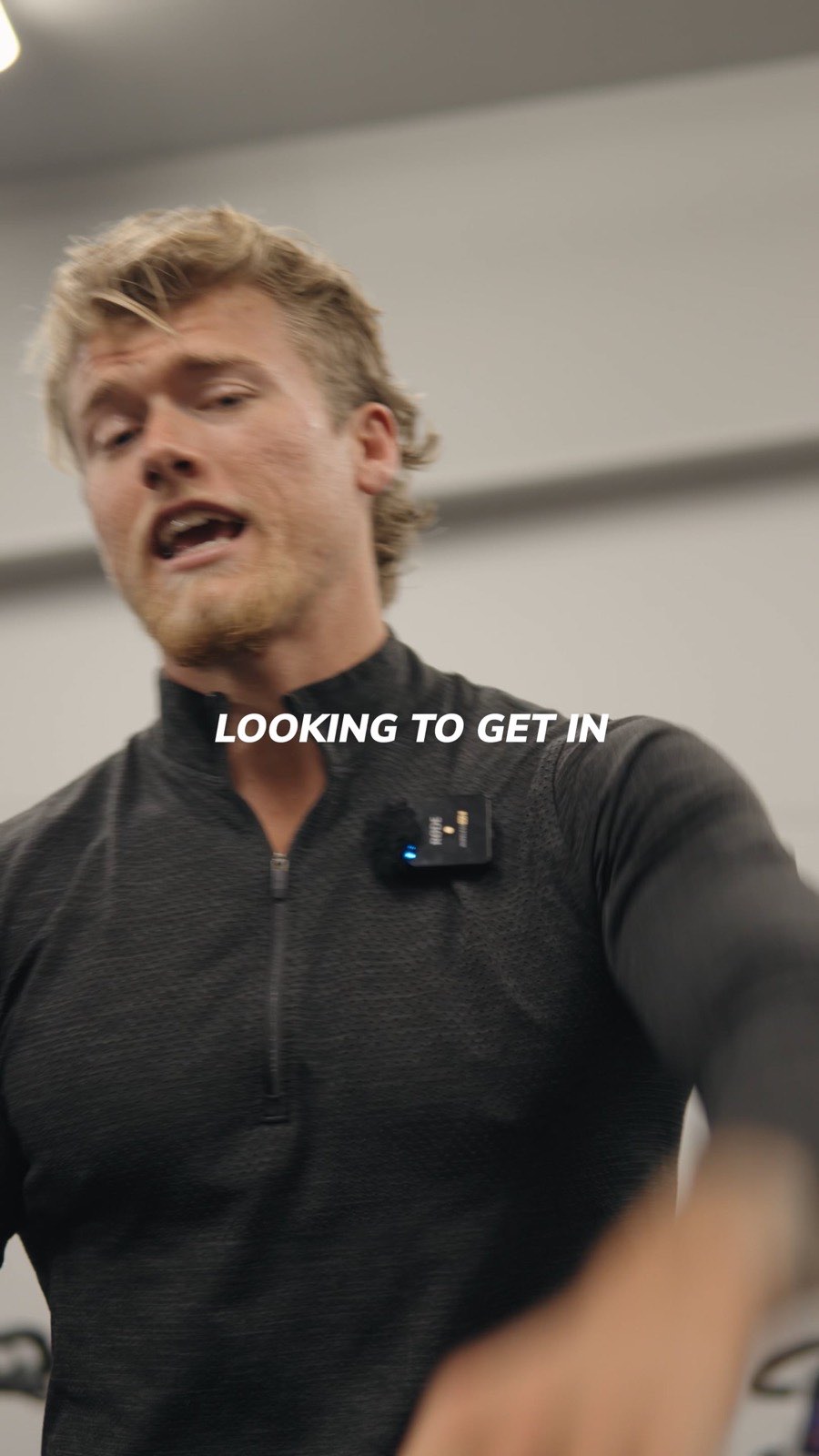 Brandon Clark mid-sentence in a gym, on-screen caption reading Looking to get in