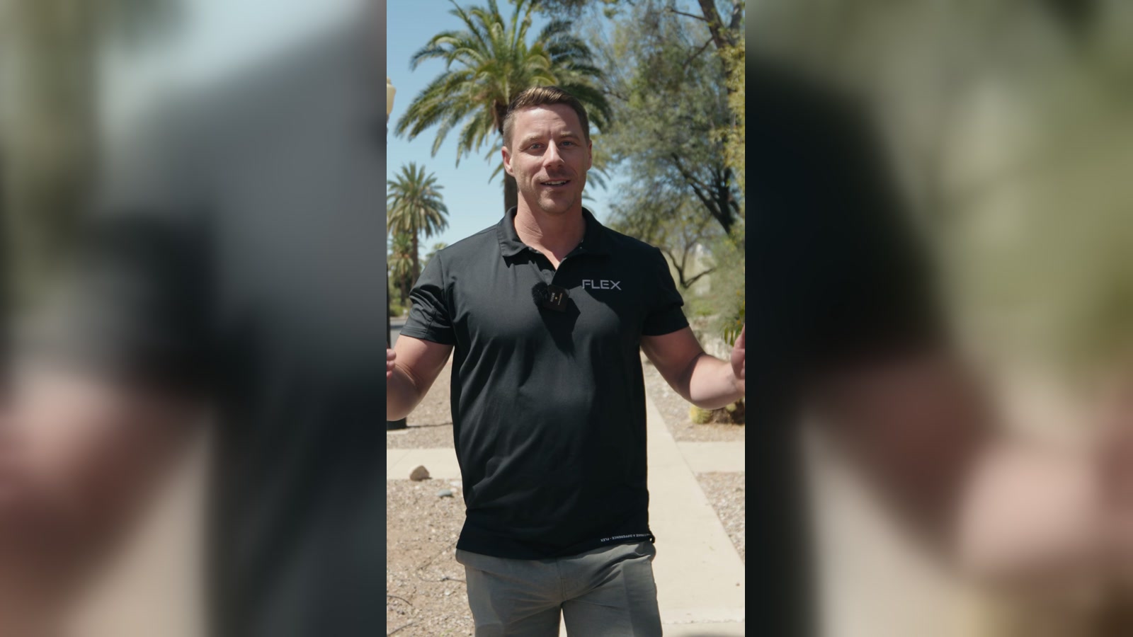 Flex PWR rep in a branded black polo talking to camera on a palm-lined street