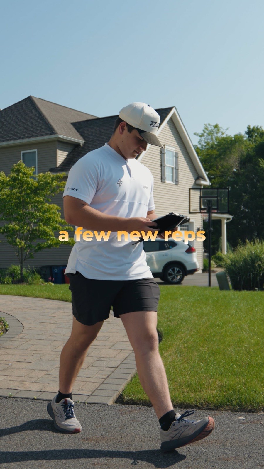 Flex PWR rep walking a suburban driveway in the sun, on-screen caption reading a few new reps